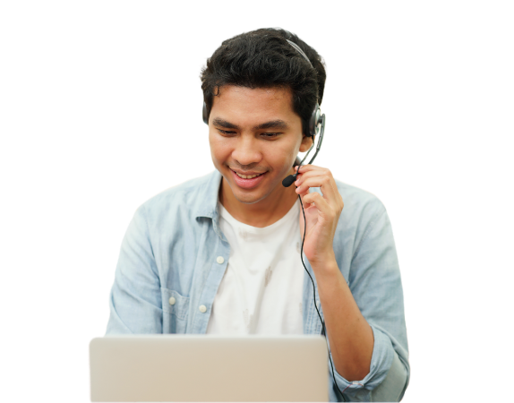 Friendly contact center agent speaking with a headset and working on a laptop